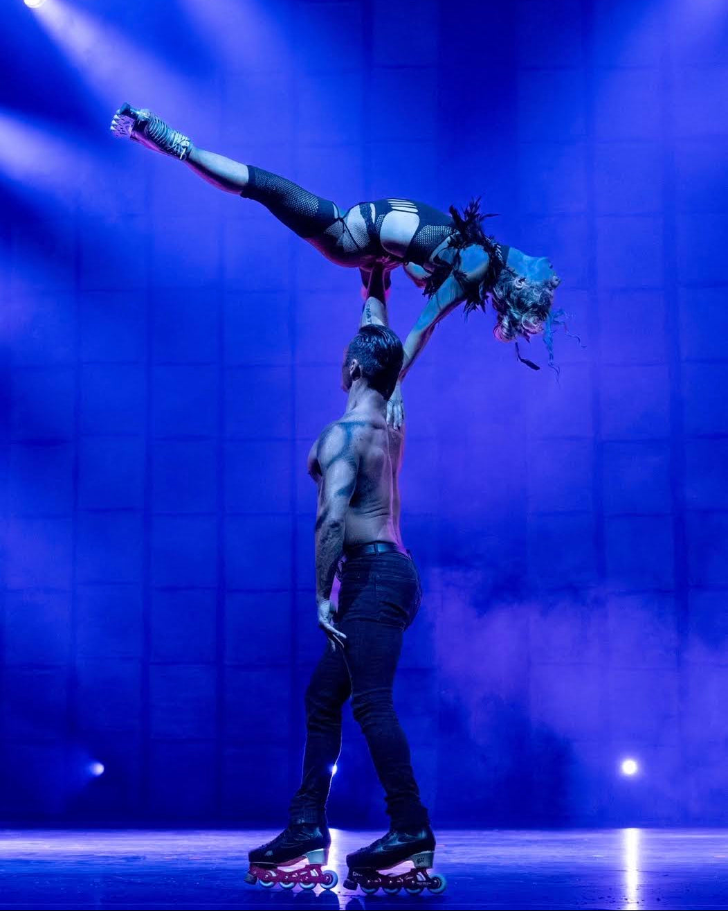 Adam Jukes performing on stage with Rosie